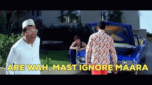 A Man Standing In Front Of A Blue Car With The Words " Are Wah Mast Ignore Maara " On The Bottom GIF