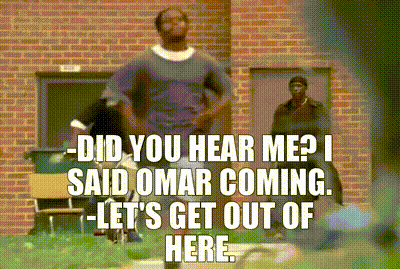 A Man Standing In Front Of A Brick Building With A Caption That Says " Did You Hear Me ? I Said Omar Coming GIF