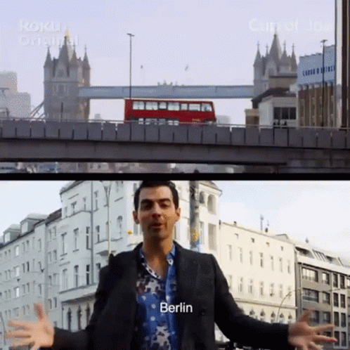 Man Standing In Front Of Berlin Bridge GIF