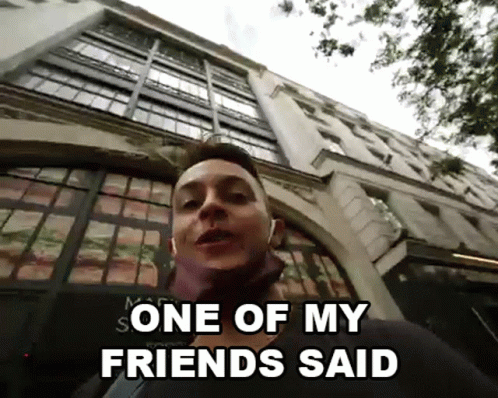 A Man Standing In Front Of A Building With The Words One Of My Friends Said GIF