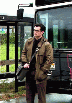 Man Standing In Front Of Bus Number 114 GIF
