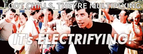 A Man Standing In Front Of A Crowd With The Words Got Chills They 'Re Multiplying It 'S Electrifying ! GIF