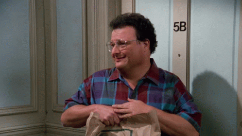 A Man Standing In Front Of A Door That Says 5B On It GIF