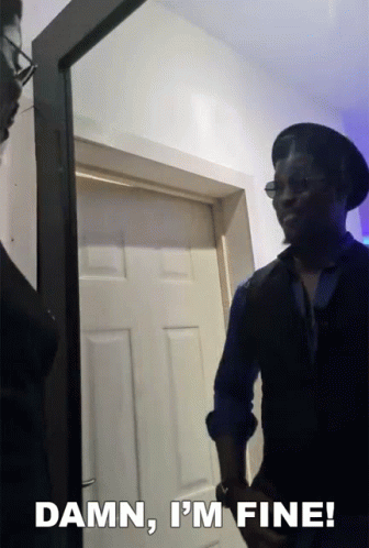 A Man Standing In Front Of A Door With The Words " Damn I 'M Fine " Above Him GIF