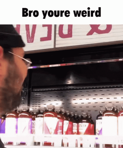 A Man Standing In Front Of A Fridge With The Words Bro Youre Weird GIF