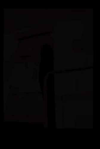 A Man Standing In Front Of A Glass Door With A Sign That Says Hotel Lounge Pool GIF
