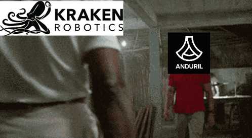 A Man Standing In Front Of A Kraken Robotics Logo And Anduril Logo GIF