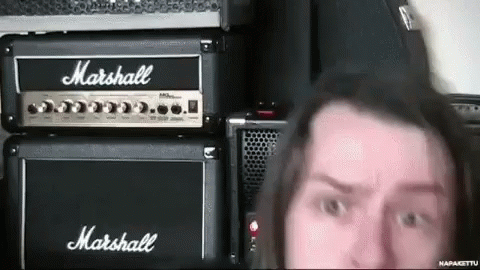 A Man Standing In Front Of A Marshall Amp GIF