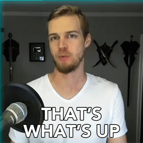 A Man Standing In Front Of A Microphone With The Words That 'S What 'S Up GIF