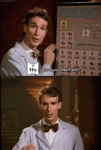 A Man Standing In Front Of A Periodic Table Says Who Iz You Playin Wit ? GIF