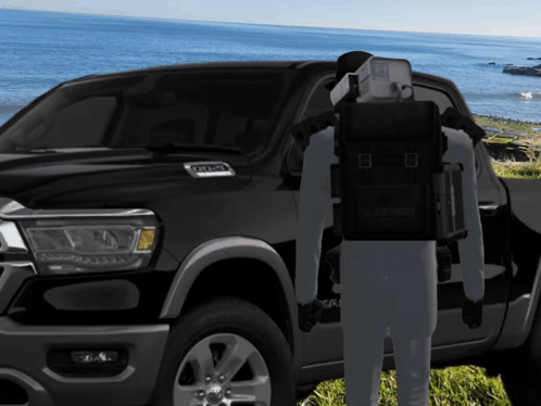 A Man Standing In Front Of A Ram Truck GIF