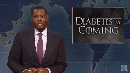 A Man Standing In Front Of A Sign That Says Diabetes Is Coming GIF