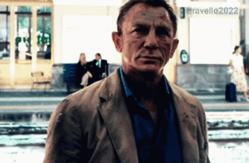 A Man Standing In Front Of A Sign That Says Eravello 2022 GIF