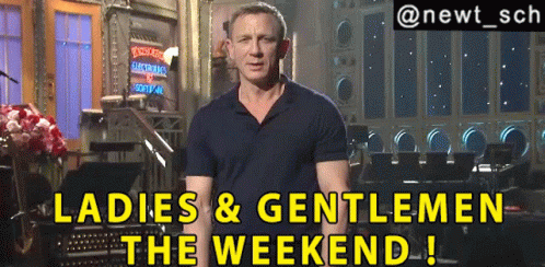 A Man Standing In Front Of A Sign That Says Ladies And Gentlemen The Weekend GIF