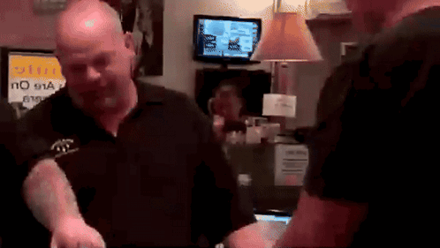 A Man Standing In Front Of A Sign That Says No 911 On It GIF