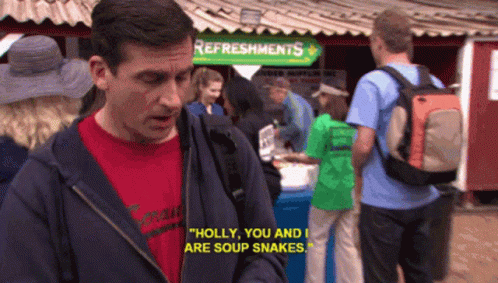 A Man Standing In Front Of A Sign That Says " Refreshments " GIF