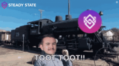 A Man Standing In Front Of A Train With The Words Toot Toot On The Bottom GIF