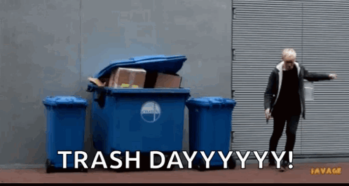 A Man Standing In Front Of A Trash Can That Says Trash Day Yy Yy GIF