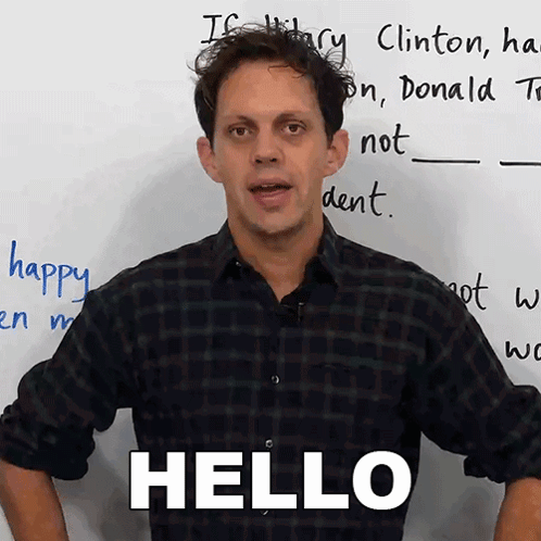 Man Standing In Front Of White Board Saying Hello GIF