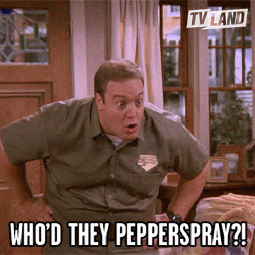 A Man Standing In Front Of A Window With The Caption Who 'D They Pepperspray ? GIF