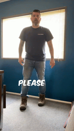 A Man Standing In Front Of A Window With The Word Please Written On The Floor GIF