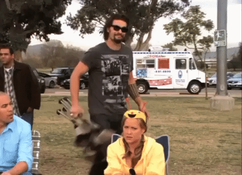 A Man Standing In Front Of An Ice Cream Truck That Says ' Coral ' On The Side GIF