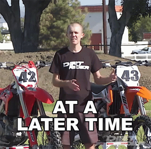 A Man Standing In Front Of Two Dirt Bikes With The Words At A Later Time GIF