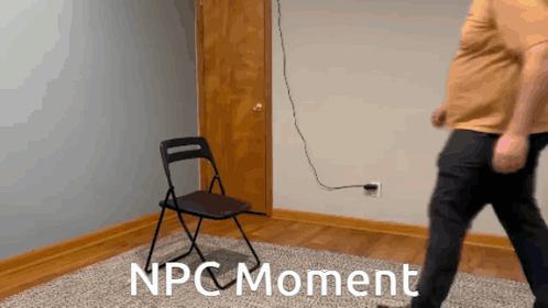 A Man Standing Next To A Folding Chair With The Words Npc Moment On The Floor GIF