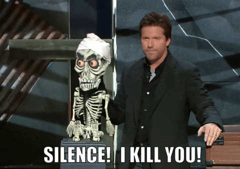 A Man Standing Next To A Skeleton With The Words Silence I Kill You On The Bottom GIF