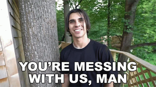 A Man Standing Next To A Tree With The Words " You 'Re Messing With Us , Man " On The Bottom GIF