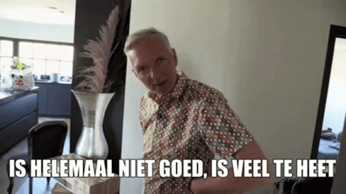 A Man Standing Next To A Vase With The Words Is Helemaal Niet Goed Is Veel Te Heet Written Below Him GIF