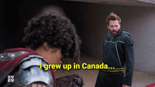 A Man Standing Next To A Woman With The Words I Grew Up In Canada GIF