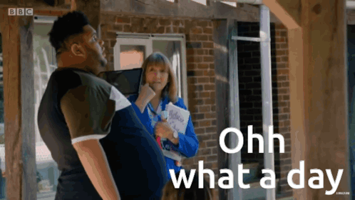 A Man Standing Next To A Woman With The Words Ohh What A Day GIF