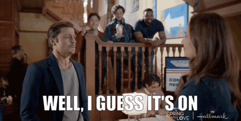 A Man Standing Next To A Woman With The Words Well I Guess It 'S On On The Bottom GIF