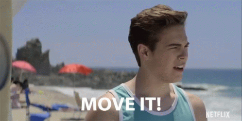 A Man Standing On A Beach With The Words Move It Written On His Chest GIF