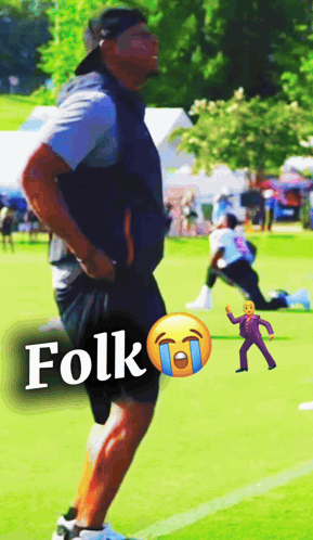 A Man Standing On A Field With The Word Folk Written On The Bottom GIF