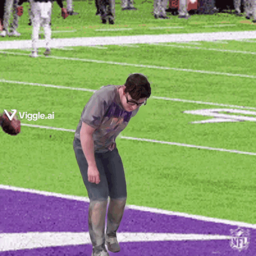 A Man Standing On A Football Field With A Viggle.ai Logo In The Corner GIF
