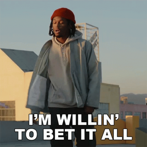 a man standing on a rooftop with the words " i 'm willin ' to bet it all "