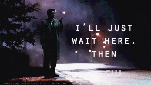 A Man Standing On The Side Of A Road With The Words " I 'Ll Just Wait Here Then " On The Bottom GIF