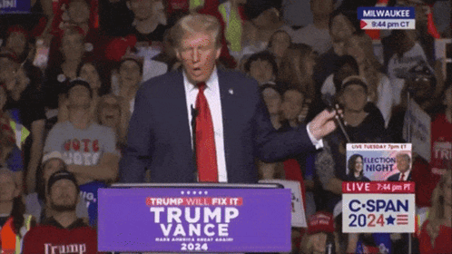 A Man Stands At A Podium That Says Trump Will Fix It On It GIF