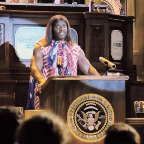 A Man Stands At A Podium With The Seal Of The President Of The United States In Front Of Him GIF