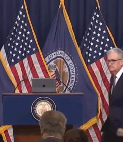 A Man Stands Behind A Podium That Says Board Of Governing GIF