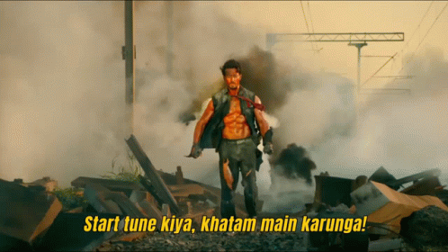 A Man Stands In A Pile Of Rubble With The Words Start Tune Kiya GIF