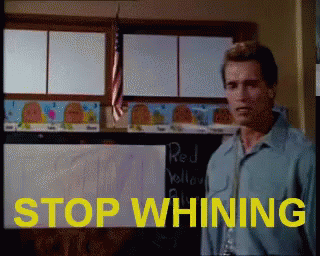 A Man Stands In Front Of A Blackboard With The Words Stop Whining GIF