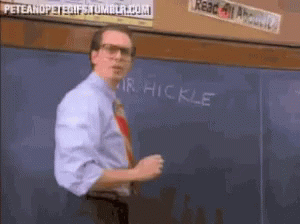 A Man Stands In Front Of A Chalkboard That Says " Mr Hickle " GIF