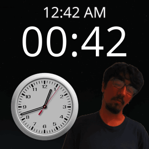 A Man Stands In Front Of A Clock That Says 12:42 Am GIF