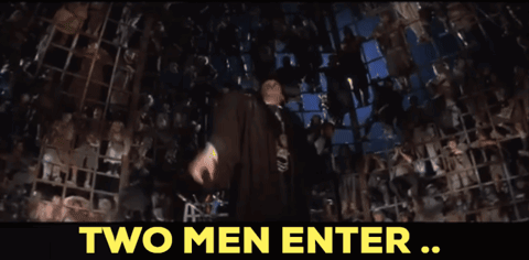A Man Stands In Front Of A Crowd With The Words One Man Leaves Above Him GIF