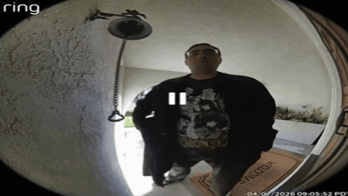 A Man Stands In Front Of A Door With A Welcome Mat GIF
