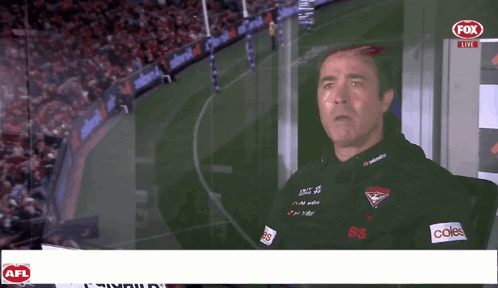 A Man Stands In Front Of A Fox Live Advertisement GIF