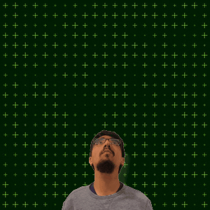 A Man Stands In Front Of A Green Background With The Number 11 + 15 On It GIF